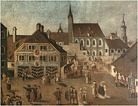 Historische Darstellung des Feuerhauses um 1750, mit Fachwerkhäusern, einer Kirche mit hohem Turm und Menschen in traditioneller Kleidung